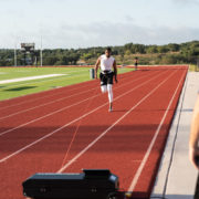 Athlete sprints with a machine waistband