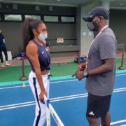 Female athlete speaking with coach