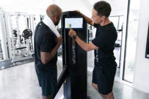 Personal trainer giving feedback to client